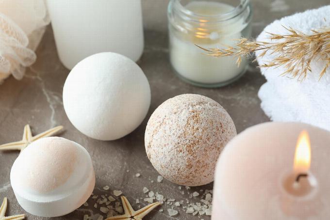 Bath bombs on table with candles